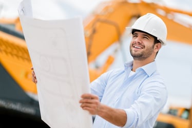 architect reviewing plans at their small business