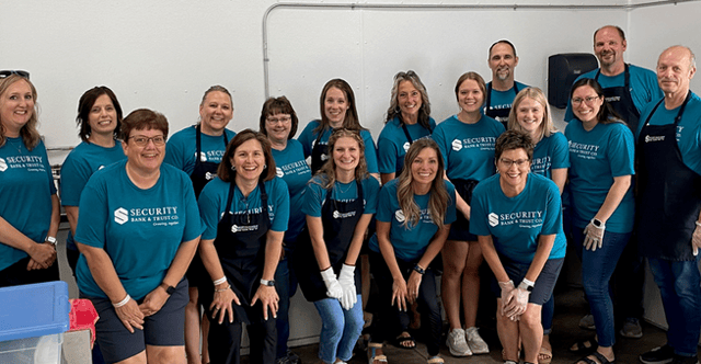 Security Bank & Trust Co. employees in matching teal shirts at Glencoe Days