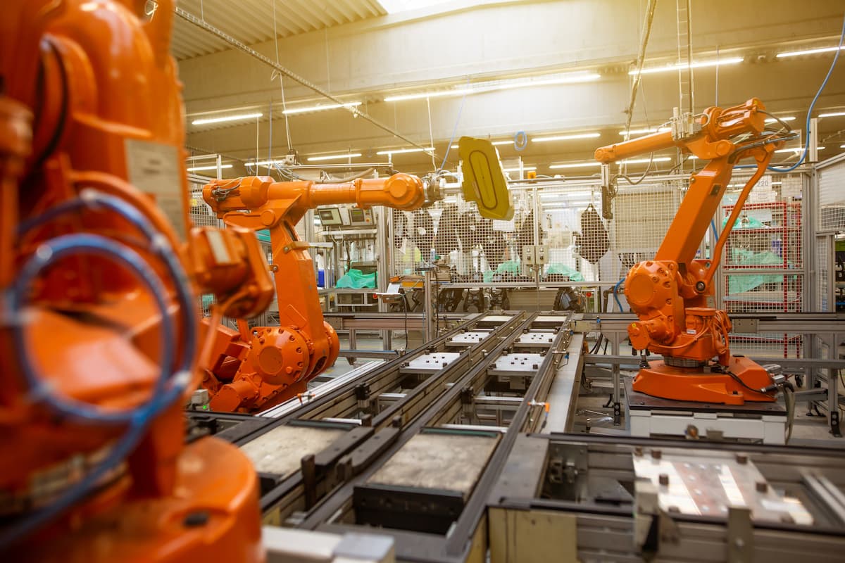 Robotic arms working on an automated manufacturing line