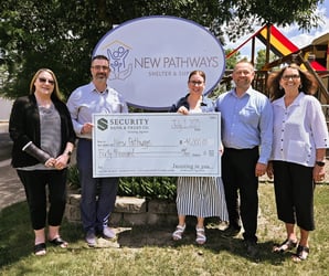 Group photo with check on donation