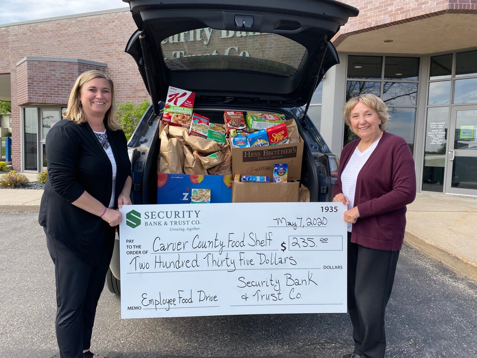Security Bank & Trust Co. employees collecting donations at the Waconia food drive