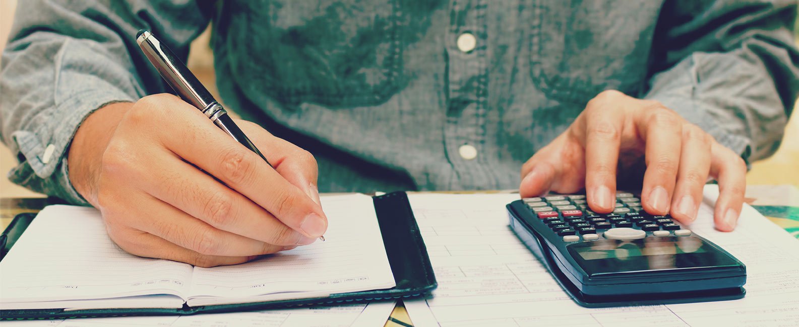 closeup of man calculating numbers