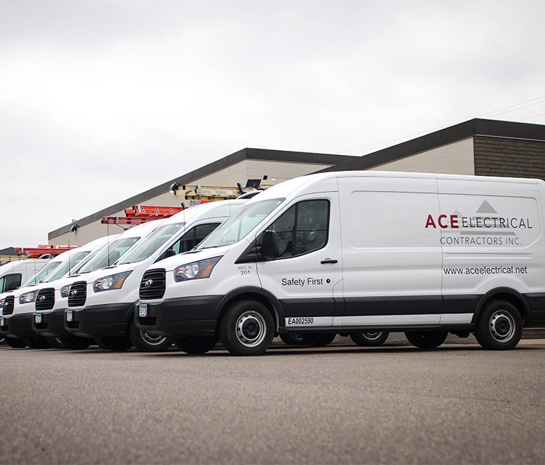 row of ACE electrical trucks