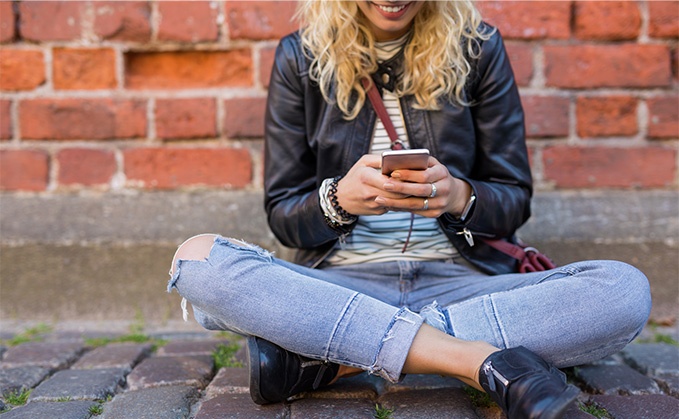 woman texting on phone