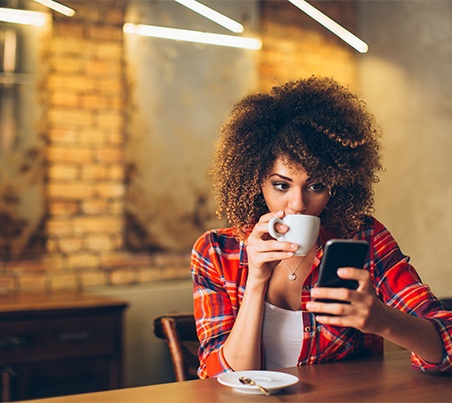 woman drinking coffee in cafe