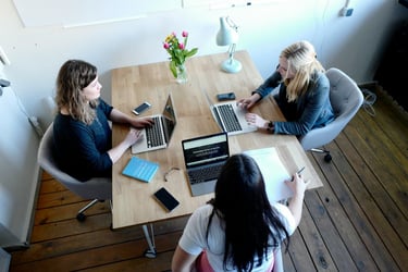 women business owner talking with her team