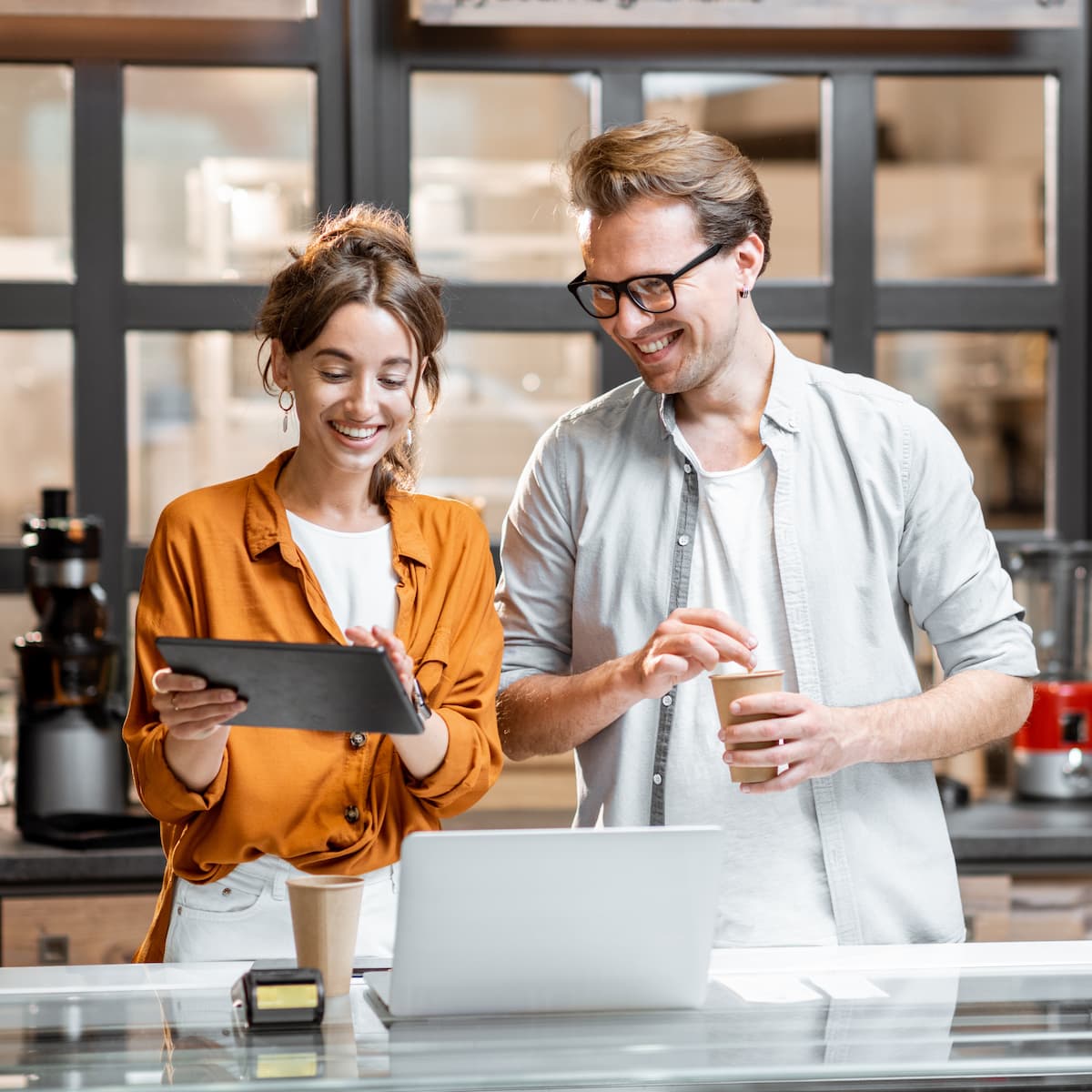 man and woman managing small business