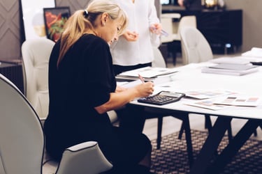 Business owner reviewing account statements at a desk