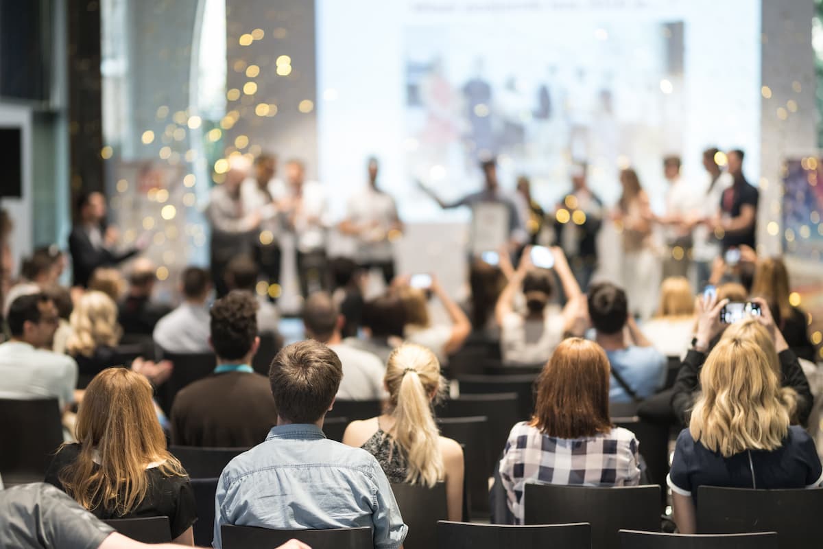 Audience applauding at a business awards ceremony