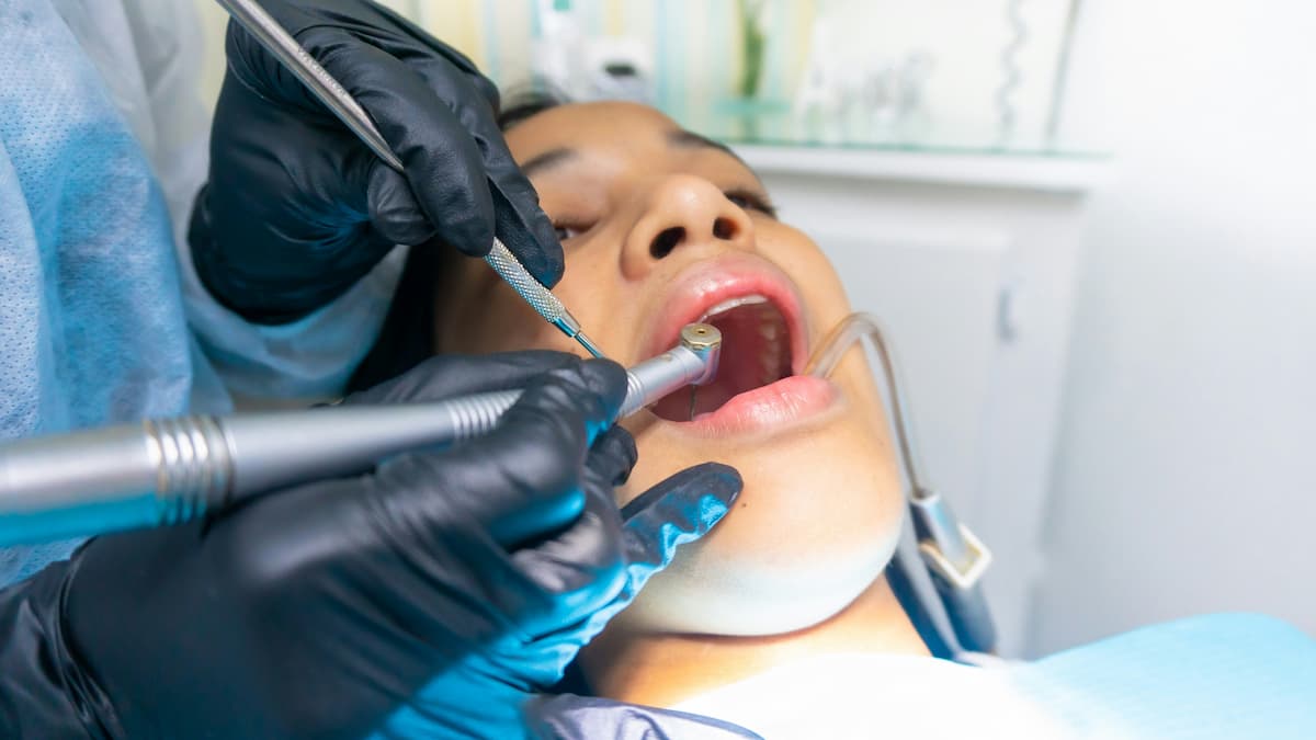 Dentist treating a patient in a Minnesota dental practice